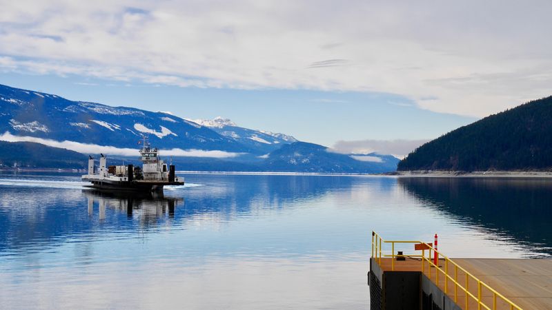 Ferry boat on blue lake near Nakusp BC