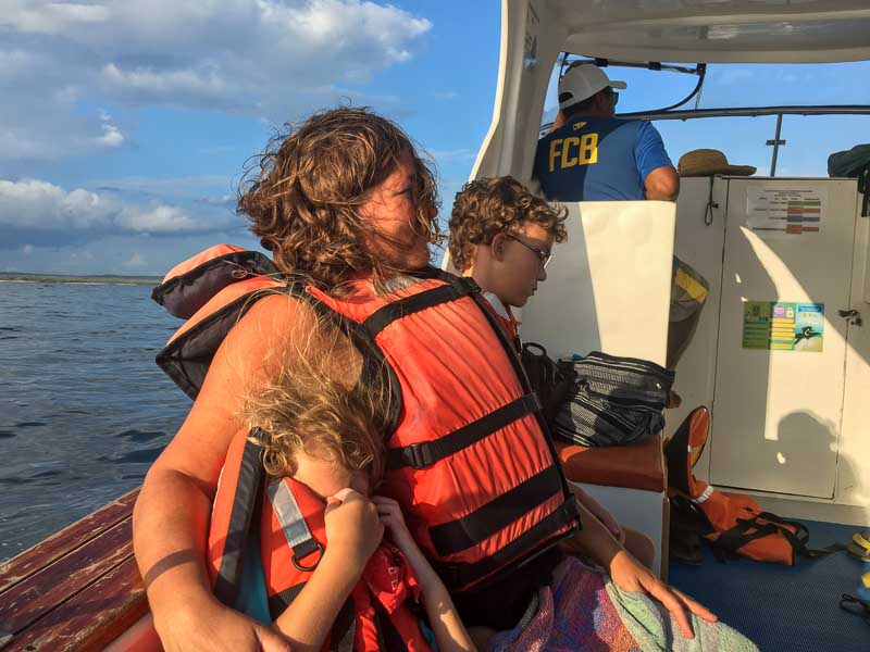Mom and the kids on the boat on a day trip from Isabela Island