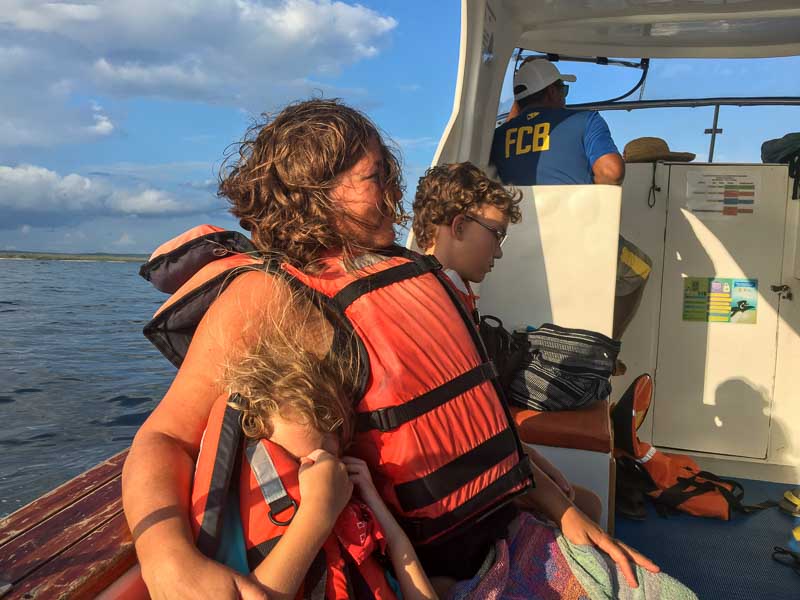 Mom and the kids on the boat on a day trip from Isabela Island