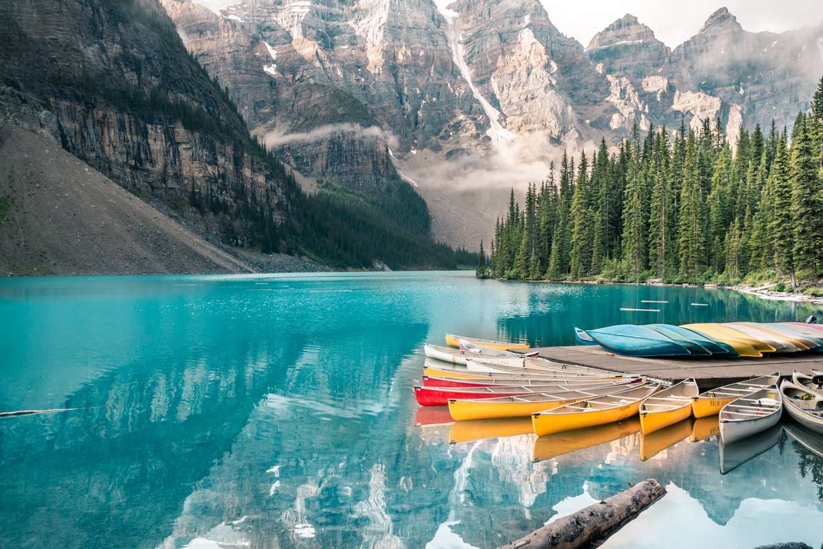 Moraine lake in Banff national park Alberta Canada canoes mountains deep blue green lake