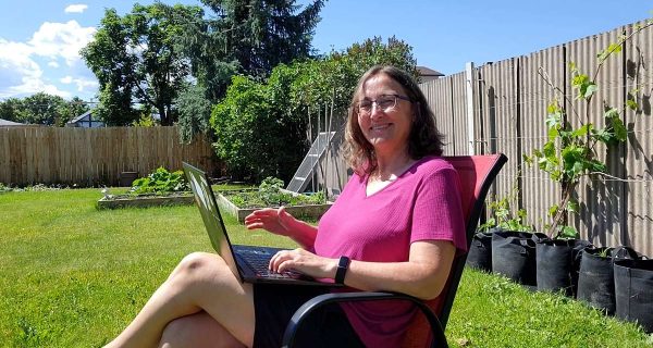 Sync Review 1200 Using Sync on Laptop in Garden