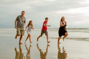 The Barefoot Nomad family on the beach in Mexico