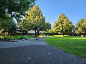 Charles driving the Segway Ninebot E3 Pro in the park