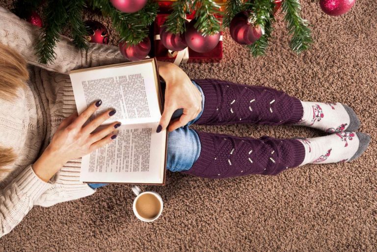 sitting on floor and reading book