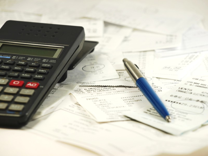 Calculating piles of receipts with a calculator
