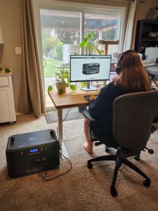 BLUETTI Apex 300 Review in office charging laptop and monitor tall