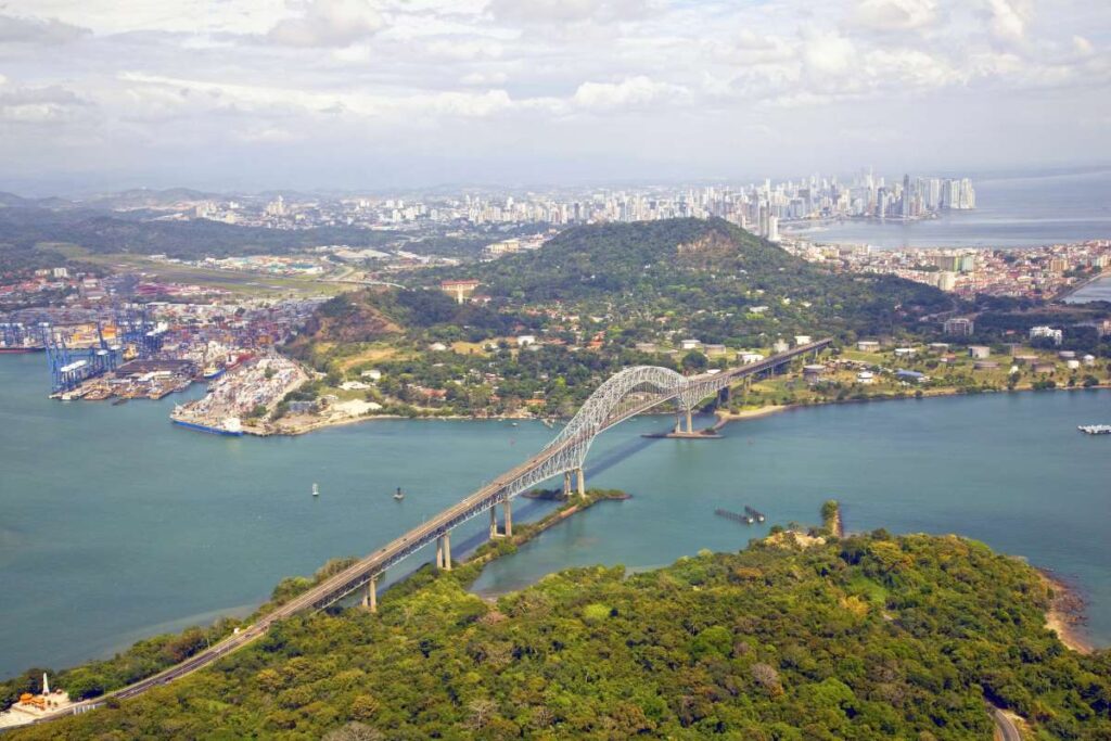 Aerial view of the Bridge of the Americas at the Pacific entrance to the Panama Canal with Panama City in the background