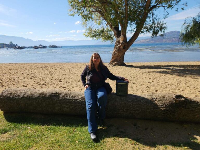 BLUETTI Elite 100 Mini on log with woman in park